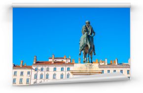 Lyon city skyline and an equestrian statue of King Louis XIV, at the Place Bellecour plaza, the largest pedestrian square in Europe, and a UNESCO World Heritage Site, in France