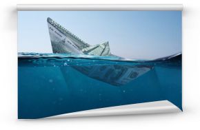 Concept paper dollar boat sinking in the sea with a view underwater. Finance and crisis, a creative idea. Falling exchange rates. Insurance