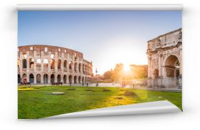 Panoramic view of Colosseum and Constantine arch at sunrise. Rome, Italy