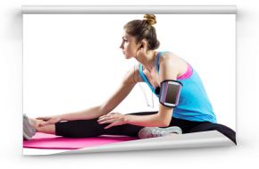 Fit woman exercising on exercise mat