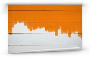 Orange color on painted wooden plank