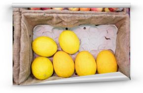 Yellow melon in crate at supermarket