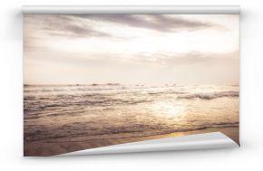 Sea beach surf waves landscape at sunset with dramatic sunset sky vintage style beige colors