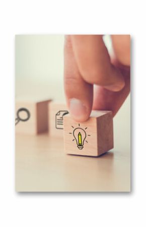 Design Thinking Process concept. Wooden blocks with icons  the key stages of the design thinking process, a solution-focused, problem-solving methodology used for innovation and strategic development.