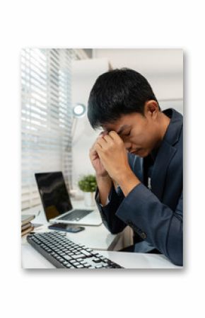 stressed asian businessman working in the office. Businessman thinking too much work concept in the office.