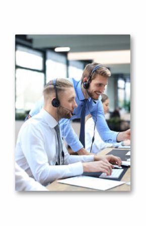 Phone operator working at call centre office helping hiss colleague.