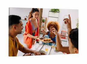 Friends sharing pão de alho and drinks at Brazilian churrasco gathering