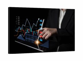 Business professional engages with digital financial data on a tablet, showcasing graphs and trends that highlight market growth and investment potential. Scalp