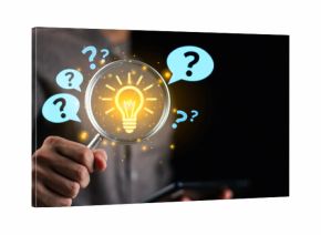 Businessman holding magnifying glass with glowing light bulb and question marks, representing problem solving, finding solutions, critical thinking, and innovative decision making.