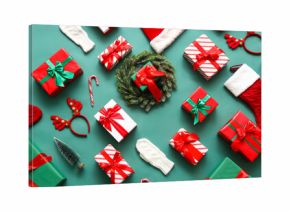 Composition with Christmas gifts and decor on green background