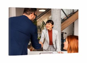 Professional Team Meeting Highlighting Diversity and Collaboration in a Modern Office