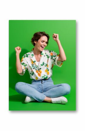 Full body picture of gorgeous young woman bob hair raised fists up celebrate she went vacation abroad isolated on green color background