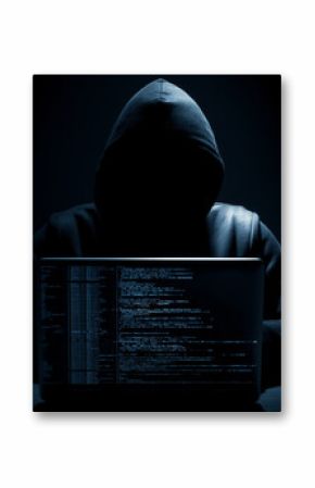 Hacker in a dark room programming malicious code on a computer screen with lines of data.  