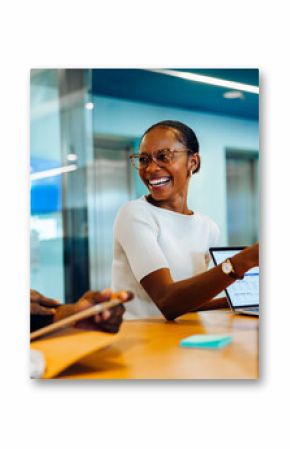 Diverse group discussing ideas in a bright and engaging office setting