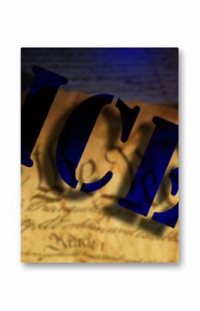 ICE - Immigration and Customs Enforcement - text over We The People text on the US Constitution