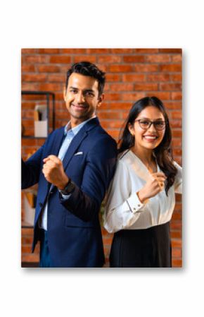 Posing with success and smiling confidently, Indian business professionals stand in office together