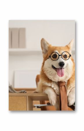 Funny business dog with eyeglasses and necktie lying on desk in office