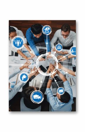 A dynamic business meeting showcasing teamwork and technology with people collaborating over data, laptops, and digital icons in a modern office environment. Amity