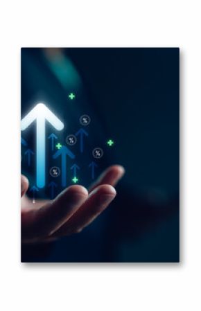 Businessman hand holding virtual glowing arrow up icon, representing business growth, financial performance, investment success and positive economic trend with percentage symbols.