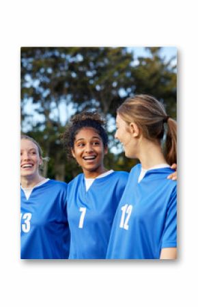 Girls teammates laughing and walking on football field