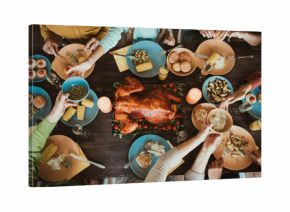 Thanksgiving table of family and friends big gathering of generations shares turkey corn and stories around a festive autumn meal