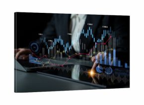 Business professional reviews financial data displayed on a laptop and tablet, highlighting trends and insights with charts and graphs in a modern workspace setting. Scalp