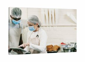 Health, inspection or people in restaurant with tablet, hygiene or food safety in online checklist. Sanitation, review or inspector in kitchen with tech, quality control or compliance in cafe service