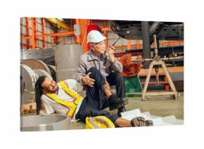 Accident worker in workplace, young man down leg injury senior supervisor emergency medical help