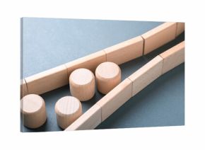 Wooden blocks forming a bottleneck to illustrate constraints and process limitations