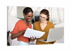 Happy young African American professional woman consulting financial or legal expert briefly, showing paper report to coworker, pointing at document, asking for advice, assistance, consultation