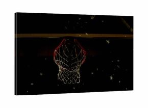 Shining basketball hoop with red rim and white net in dim court, with floating star decorations