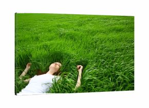 beautiful girl lying down of grass