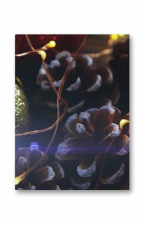 Image of glowing lights moving over christmas bauble and decorations