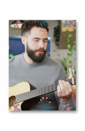 Image of flowers over happy diverse couple playing guitar together