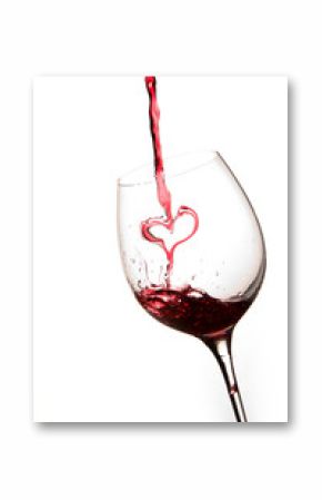 Pouring a heart of red wine in a glass