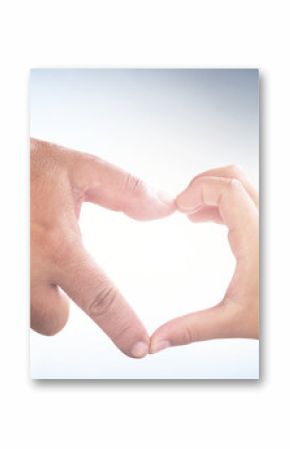 Father day concept: Father's and son's hands forming shape of heart on blurred sunshine blue sky background