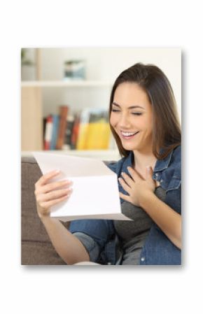 Candid woman reading hopeful news in a letter