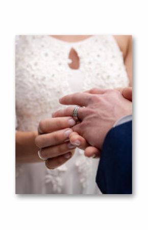 Bride placing ring on groom's finger during wedding ceremony, symbolizing love