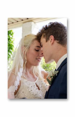 Bride and groom sharing romantic moment during wedding dance outdoors