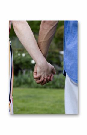 Holding hands outdoors, couple sharing peaceful moment together in park