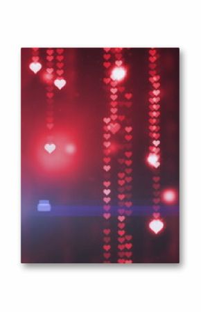 Image of glowing red hearts over black background