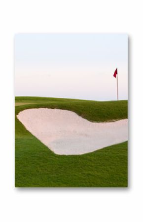 Heart shaped sand bunker in front of golf green