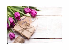 words FOR YOU and bouquet of tulips on wooden background