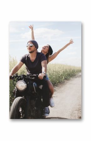 couple in field on motorcycle