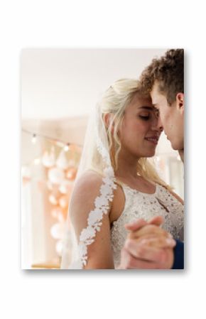 Bride and groom sharing intimate dance, celebrating love at wedding reception
