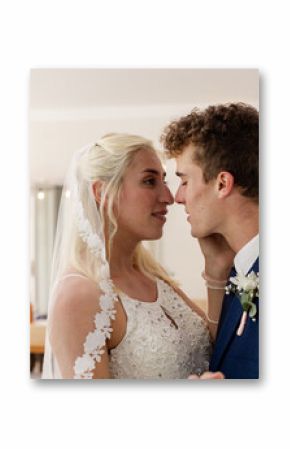 Bride and groom looking into each other's eyes during wedding celebration