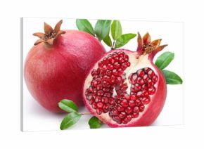 Juicy pomegranate and its half with leaves.
