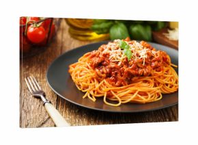 Delicious spaghetti served on a black plate