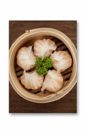 Chinese dumpling in a bamboo steamer box