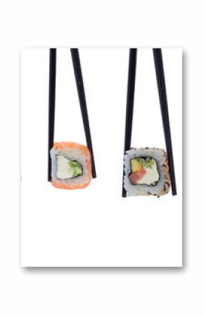 A lot of sushi and rolls in black chopsticks isolated on white background